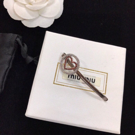 MIUMIU 26S CRYSTAL HEART LOGO HAIR CLIP IN SILVER TONE METAL 617641