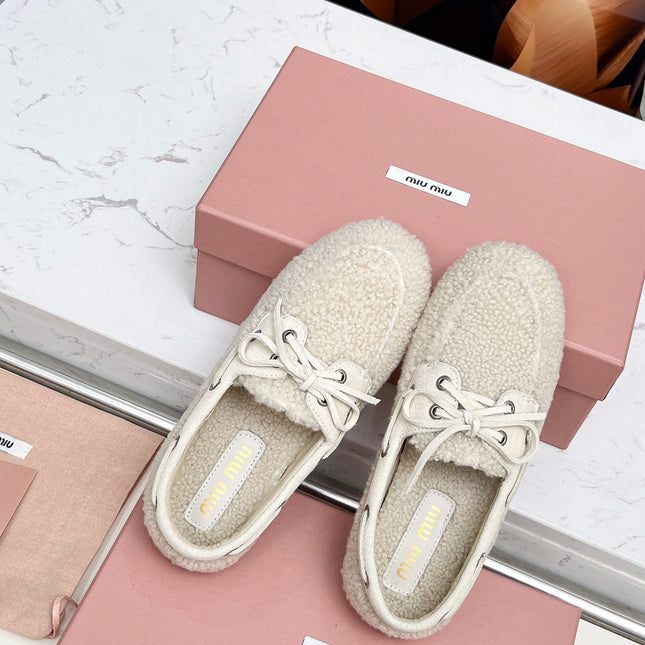 MIUMIU 26S BOAT LOAFERS IN BEIGE SHEARLING