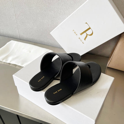 THE ROW 26S FLAT THONG SANDALS IN BLACK CALFSKIN