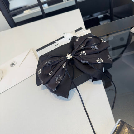 CHANEL 26S BOW HAIR CLIP IN BLACK SATIN 503133