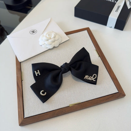 CHANEL 26S BOW HAIR CLIP IN BLACK SATIN 503134