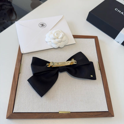 CHANEL 26S BOW HAIR CLIP IN BLACK SATIN 503134