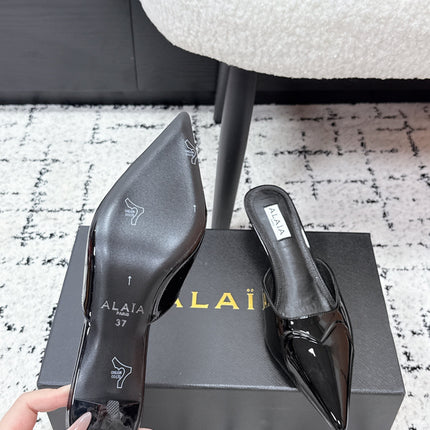 ALAIA 26S HEELED MULES 65 MM IN BLACK GLOSSY CALFSKIN