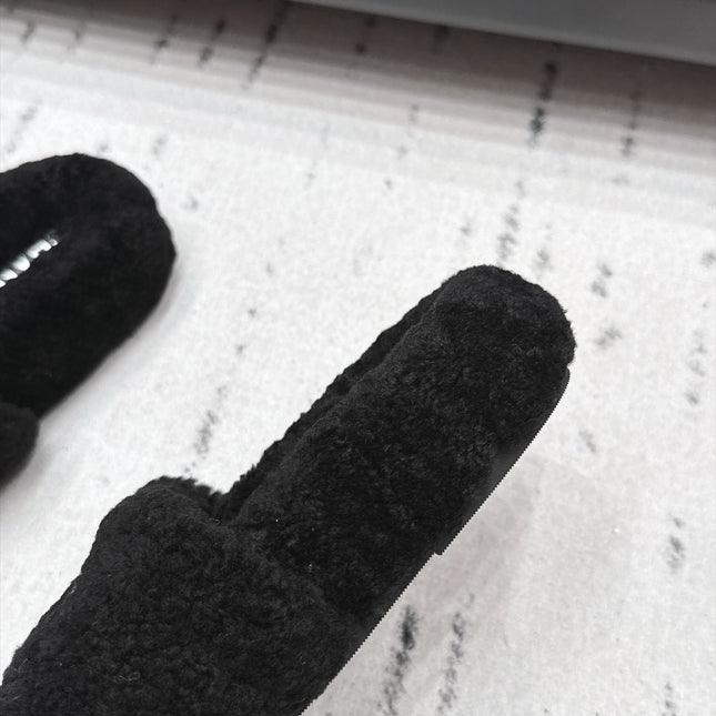 CHANEL 26S SLIDE MULES IN BLACK SHEARLING AND WHITE CC LOGO