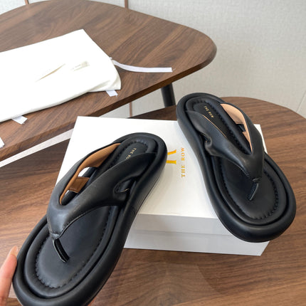 THE ROW 26S PUFFED THONG SANDALS IN BLACK CALFSKIN
