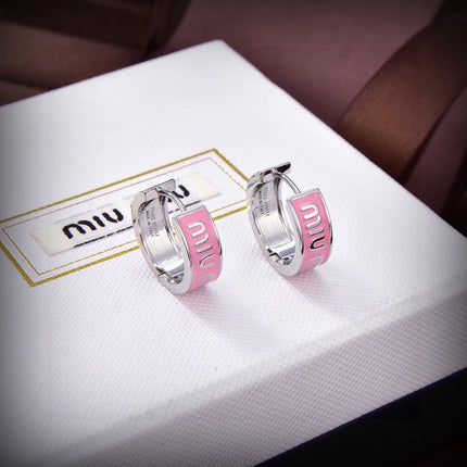MIUMIU 26S LOGO HUGGIE HOOP EARRINGS IN PINK ENAMEL AND SILVER TONE METAL 622799