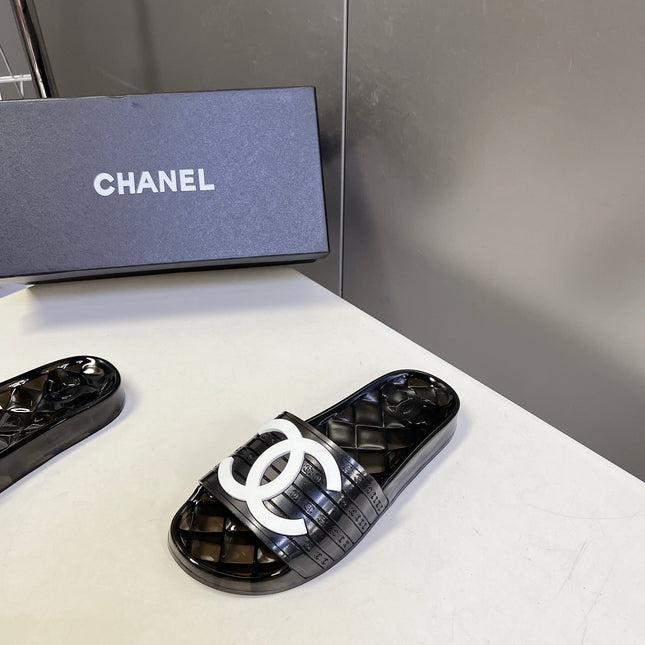 CHANEL 26S SLIDES IN BLACK PVC WITH WHITE LOGO