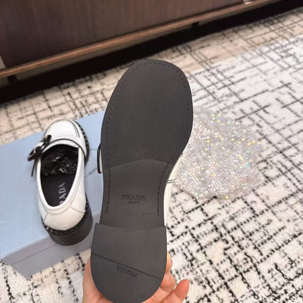 PRADA 26S BUCKLED LOAFERS IN WHITE CALFSKIN