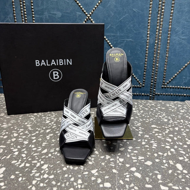 BALMAIN 26S HIGH-HEEL SANDALS 95 MM IN BLACK CALFSKIN AND WHITE FABRIC