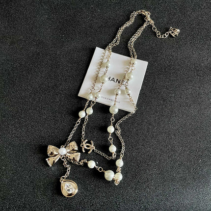 CHANEL 26S DOUBLE C LOGO PEARL LAYERED CHAIN BOW & CRYSTAL DROP NECKLACE IN GOLD METAL 629883