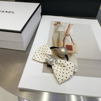 CHANEL 26S BOW HAIR TIE IN BLACK WITH WHITE POLKA DOTS 505301