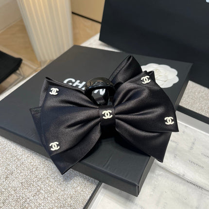 CHANEL 26S BOW HAIR CLIP IN BLACK RIBBON 512128