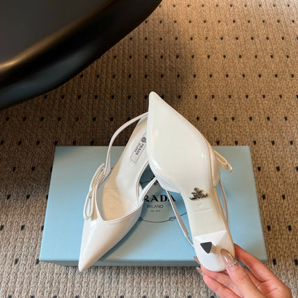 PRADA 26S BOW DETAIL SLINGBACK PUMPS 75MM IN WHITE PATENT CALFSKIN