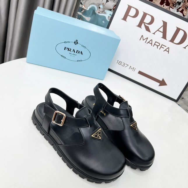 PRADA 26S RUBBER LOGO CHUNKY SOLE FISHERMAN SANDALS IN BLACK CALFSKIN