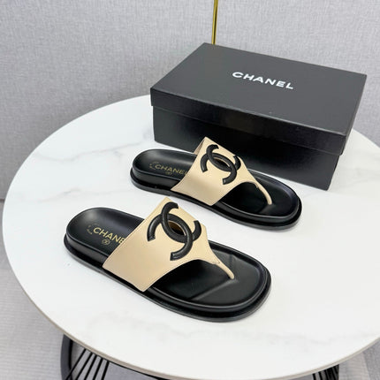 CHANEL 26S CC THONG SLIDES IN BEIGE AND BLACK LAMBSKIN
