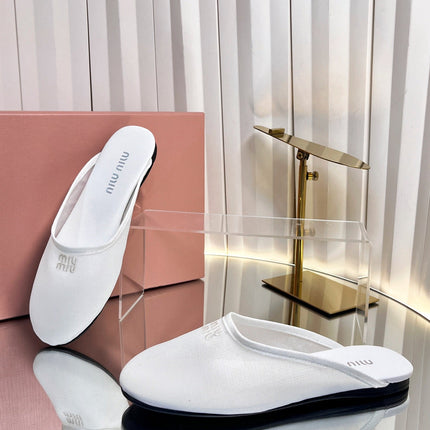 MIUMIU 26S FLAT MULES IN WHITE FABRIC AND LEATHER