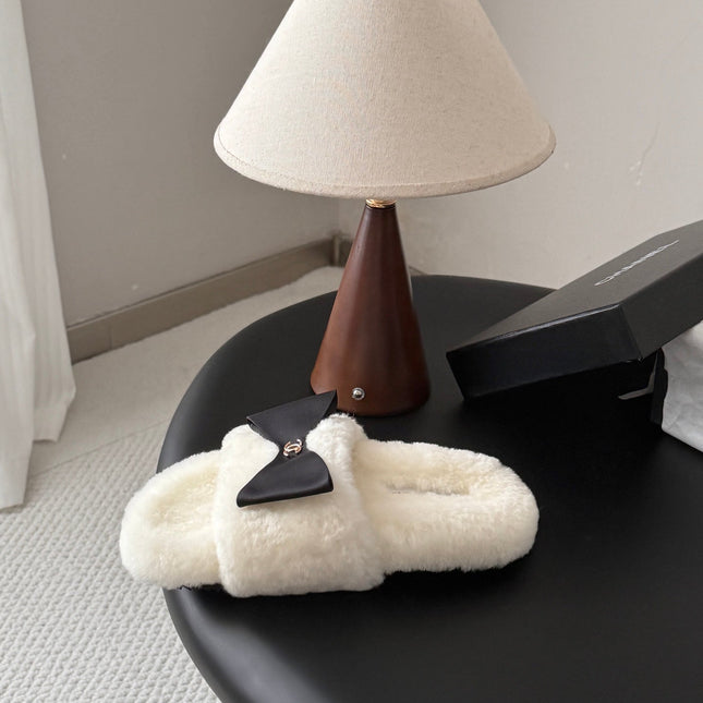 CHANEL 26S SLIDE SANDALS IN WHITE SHEARLING WITH BLACK BOW