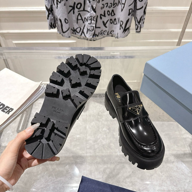PRADA 26S PLATFORM LOAFERS 45MM IN BLACK SHINE CALFSKIN