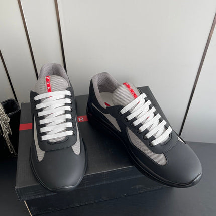 PRADA 26S AMERICA CUP SNEAKERS IN BLACK SOFT RUBBER AND BIKE FABRIC