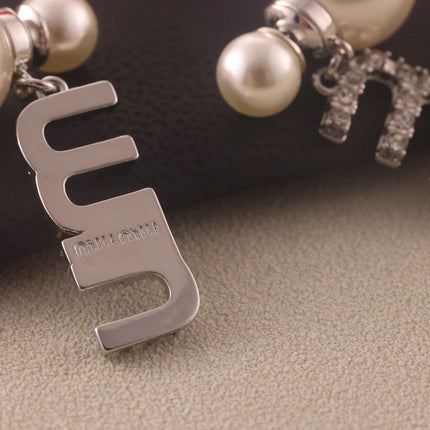MIUMIU 26S CRYSTAL LOGO PEARL DROP EARRINGS IN SILVER TONE METAL 620414