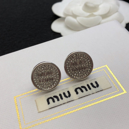 MIUMIU 26S CRYSTAL MIU LOGO ROUND STUD EARRINGS IN SILVER TONE METAL 630845